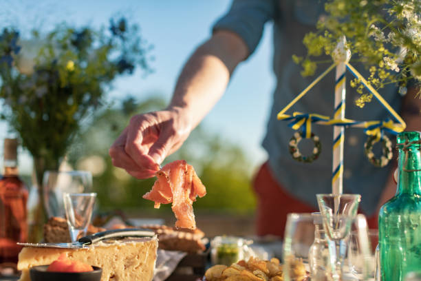 istock a man picks a piece of salmon 1234527366