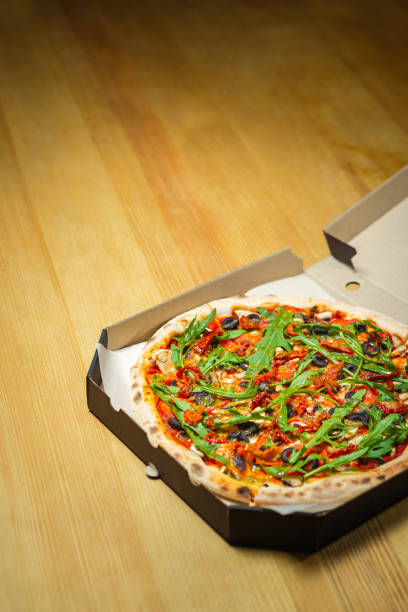 istock Delicious Italian pizza delivery in cardboard box 1234562355