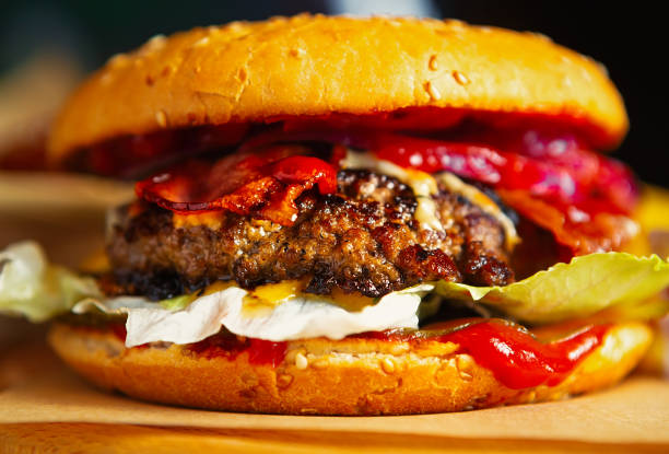 istock Delicious beef burger with natural meat cooked on grill in fastfood restaurant for dinner meal.Traditional American hamburger dish for lunch 1234568340