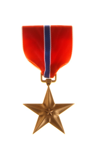 U.S. military bronze star medal on a white background.