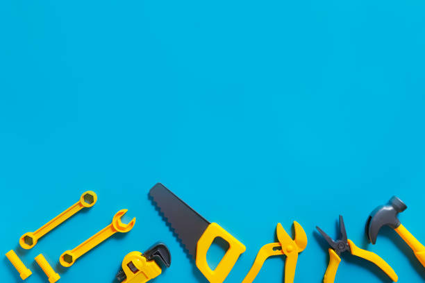 istock Toys background. Top view of toy tools on blue background 1234583821