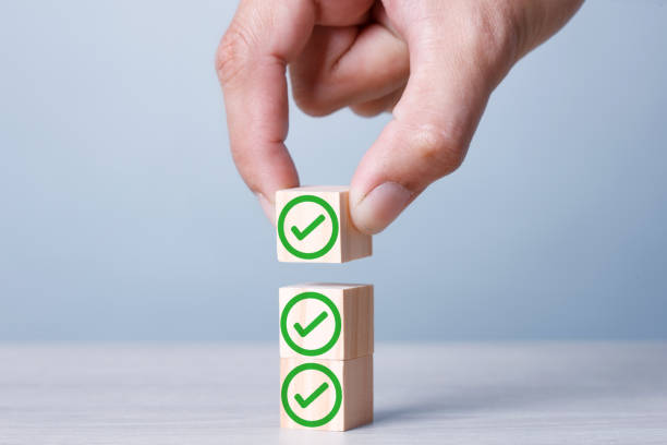 istock Three Stack of Cubics True symbols Right. Accept. Yes. Evaluation on wood cubic on blue background. 1234586932