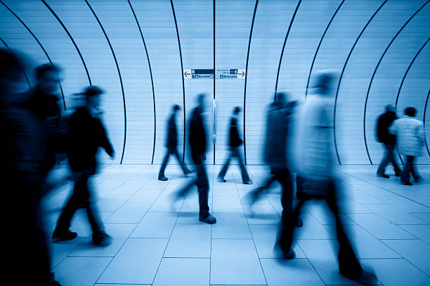 motion blurred people against modern tunnel XL - people motion blurred commuters at munich underground - camera canon 5D - unsharped RAW - adobe colorspace perpetual motion stock pictures, royalty-free photos & images