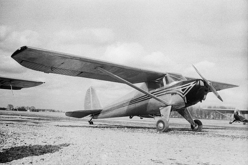 1946 Luscombe 8A airplane photographed in 1948. Ames, Iowa, USA. Scanned film with significant grain.