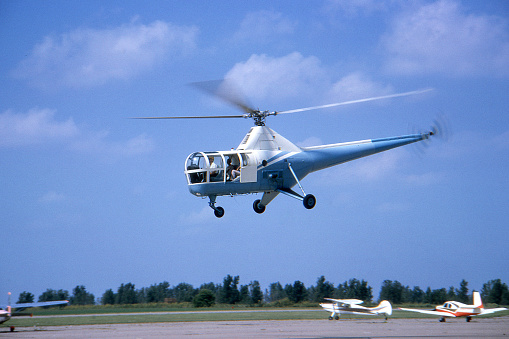 Sikorsky H-5 helicopter built about 1950 and photographed in USA in 1964. Kodachrome scanned film with grain.