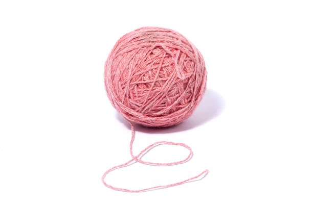 istock ball of woolen pink thread isolated on white background. 1234612312