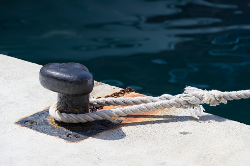 Mooring post in the port for fixing yachts and ships of boats and caterers.
