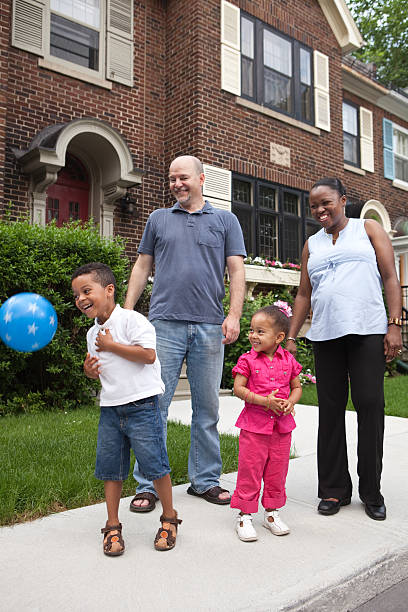 istock Family in front of house 123465653