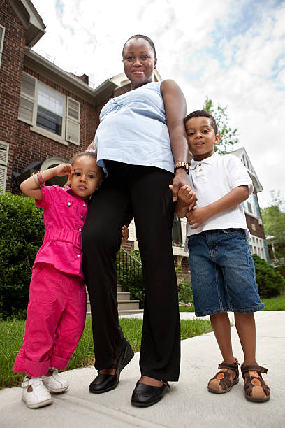 istock Pregnant mother walking with her children 123465757