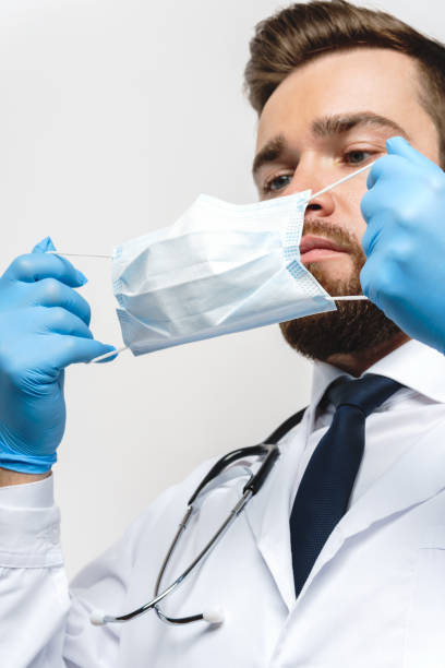istock Young doctor is wearing prevention mask 1234658599