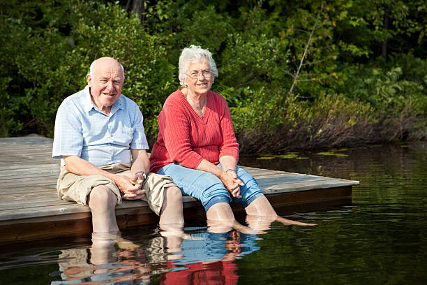istock Senior couple enjoying retirement by a lake 123466028