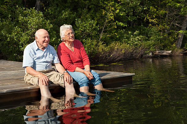 istock Senior couple enjoying retirement by a lake 123466033