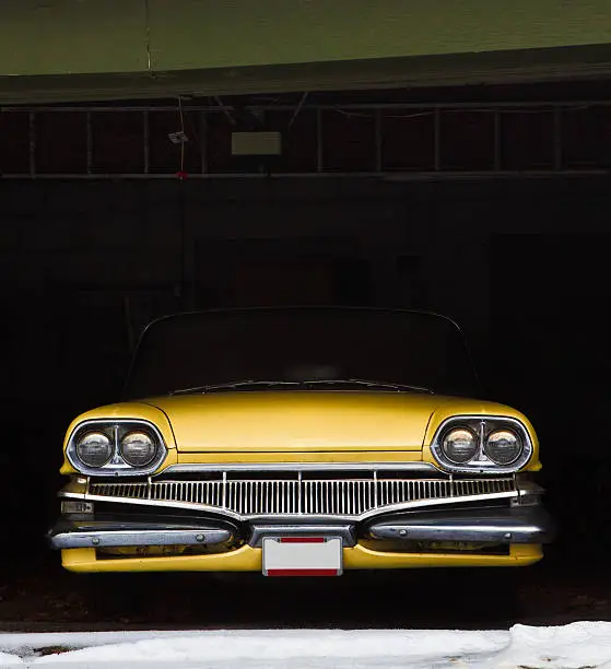 Photo of Vintage car in garage for winter