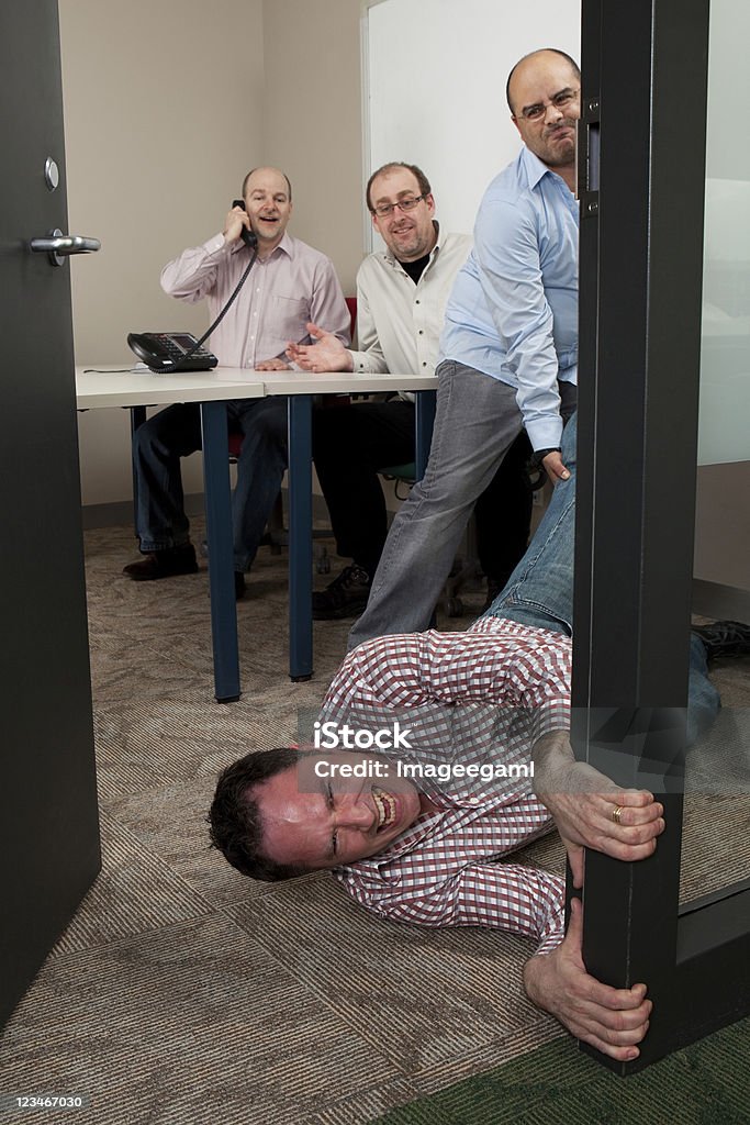 Not another meeting or You`re Fired Businessman sick and tired of being dragged into meetings Office Stock Photo