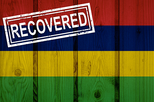flag of Mauritius that survived or recovered from the infections of corona virus epidemic or coronavirus. Grunge flag with stamp Recovered