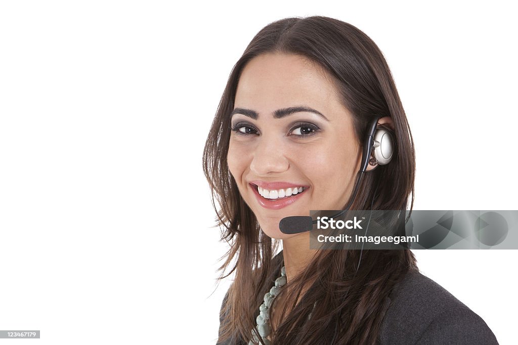 A happy customer service representative wearing a headset Studio business portrait Busy Stock Photo
