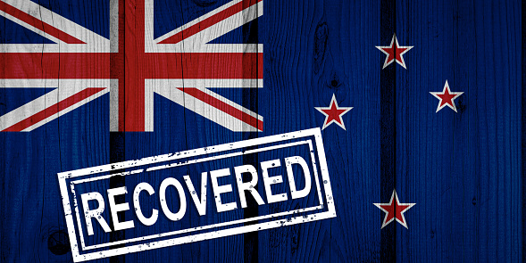flag of New Zealand that survived or recovered from the infections of corona virus epidemic or coronavirus. Grunge flag with stamp Recovered