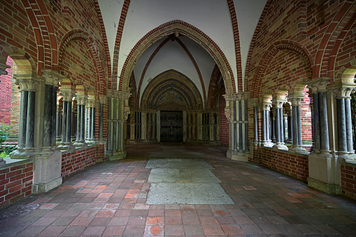 View into the historic narthex called Paradise at the Luebeck Cathedral built as a cloister hall with open arcades in brick architecture, selected focus, narrow depth of field