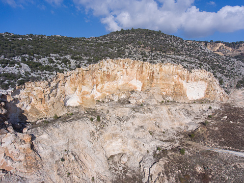 Aerial view of Marble quarry ledges. Terraces of cutted stone material.