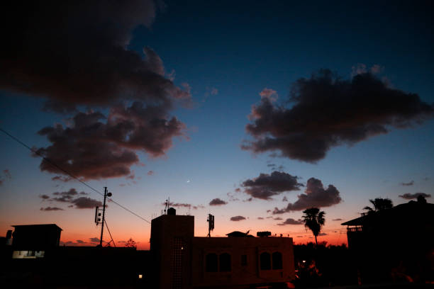 The sunset - with the sunshine and clouds above the horizon