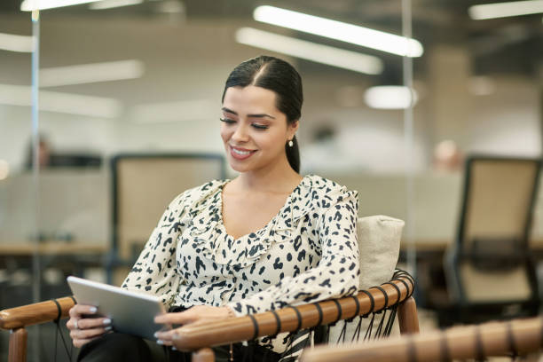 istock Relaxed Young Hispanic Businesswoman Using Digital Tablet 1234775866