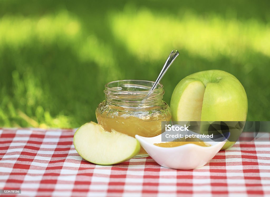 Apple jam Jar of apple jam on the table in the summer garden Apple - Fruit Stock Photo