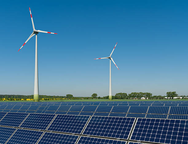istock Solar panels and wind turbines against a rapeseed field 123479143