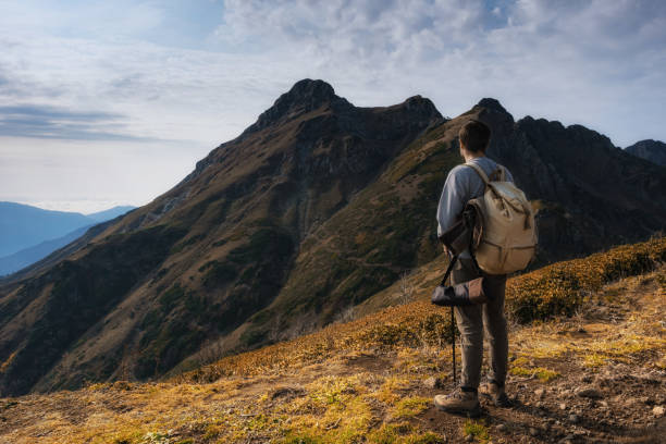 istock Young male hipster in the mountains in autumn 1234813607
