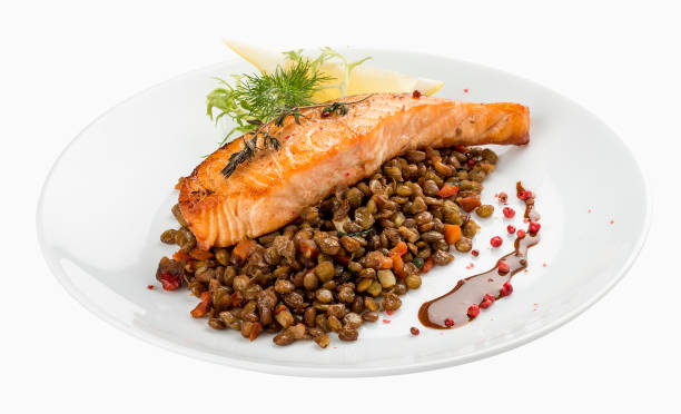 istock Salmon steak with lentils. On a white background 1234840884