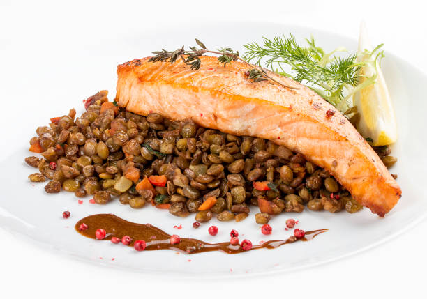 istock Salmon steak with lentils. On a white background 1234841428