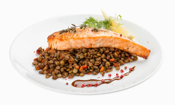 istock Salmon steak with lentils. On a white background 1234841930