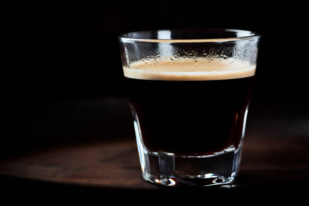 istock Coffee in glass cup on dark background. Close up. 1234846570