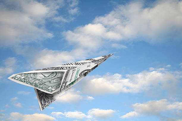 money flying away  making money origami stock pictures, royalty-free photos & images