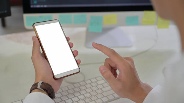 istock Close up shot A man using a smartphone with a blank screen. 1234922556