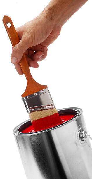 istock dipping brush into red paint can XXL 123493122
