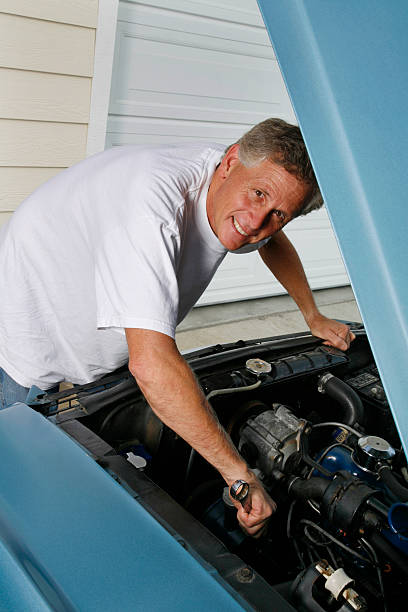 istock retired man repairing the car 123495500