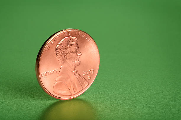 Close-up of vintage US one cent coins from 1960. Accurate clipping paths (excluding shadow).