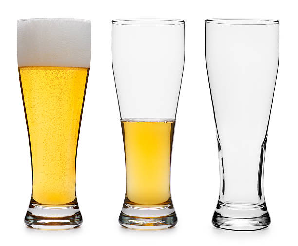 tre bicchieri di birra in vari stadi - beer beer glass isolated glass foto e immagini stock