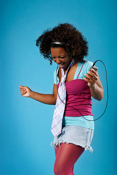 istock Girl Rocking Out with a MP3 Player 123500226
