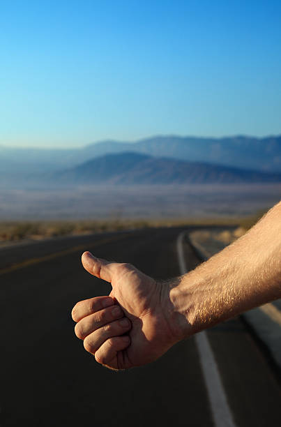istock Hitchhiker Holding out his Thumb 123500603