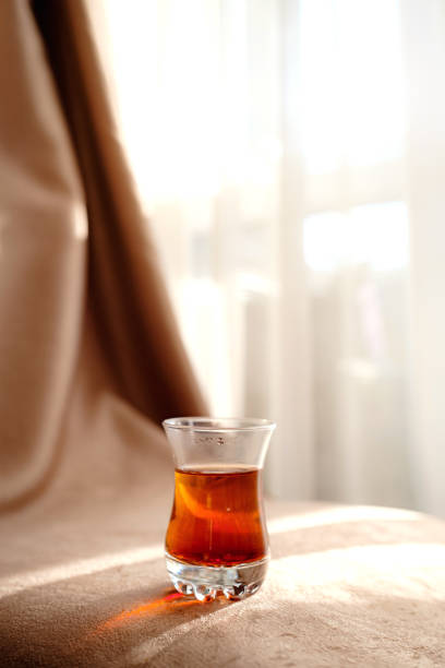 istock traditional turkish tea cup on fabric background 1235008125