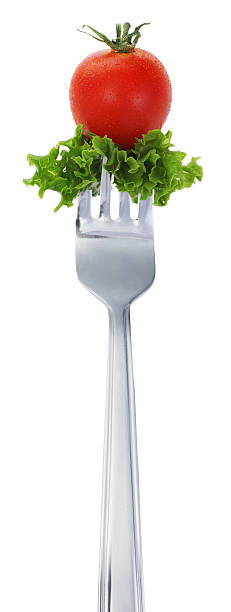 istock Salad and Tomato on a Fork Isolated with White 123501051