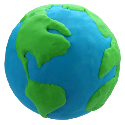 World environment day concept: Selective focus green earth, Asian woman giving world. Original source from Nasa on https://visibleearth.nasa.gov/images/54388/earth-the-blue-marble