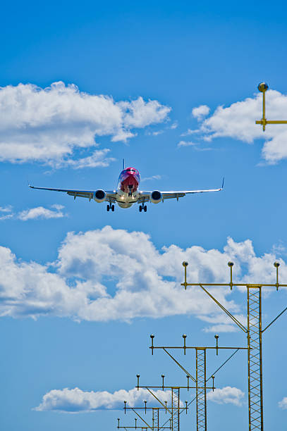istock Airplane landing on a sunny day 123503003