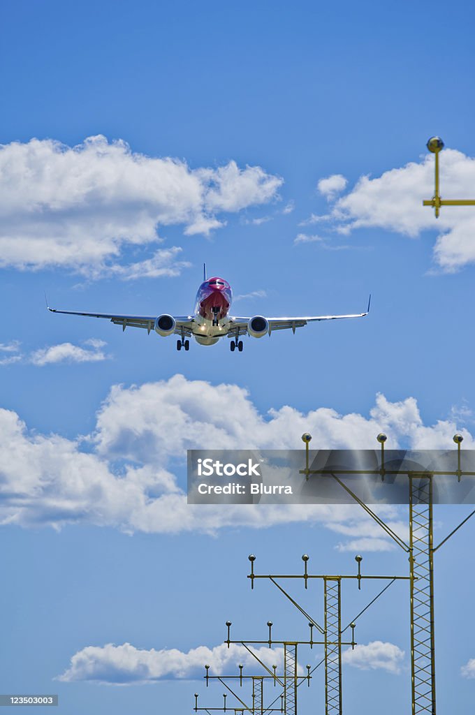 Airplane landing on a sunny day Aerospace Industry Stock Photo