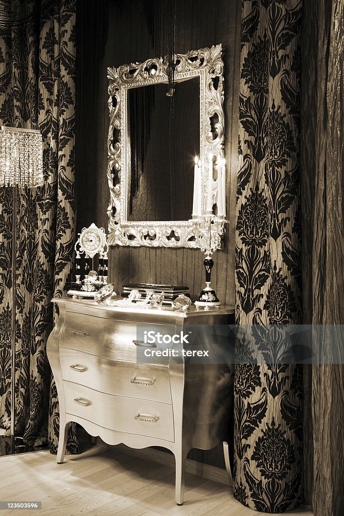 mirror and clock mirror, a clock and burning candles in the candlestick Antique Stock Photo