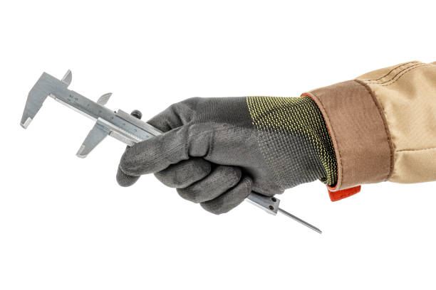 istock Vernier caliper in worker hand in black protective glove and brown uniform isolated on white background 1235050697