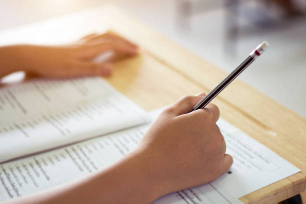 istock Students in uniform are doing the test in the classroom. 1235050882