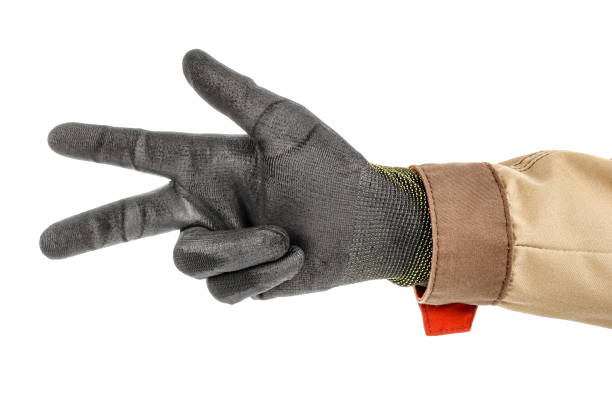 istock Worker hand in black protective glove and brown uniform doing number three gesture isolated on white background 1235051227