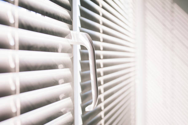 istock Modern plastic Shutter Jalousie in a room with sunlight 1235054876
